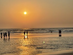 Mesmerizing sunset over the tranquil sea, painting the sky in warm hues of orange and pink – a breathtaking coastal evening scene