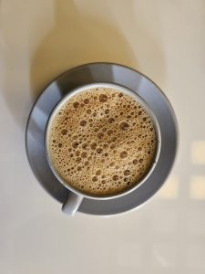 A cup of frothy south Indian filter coffee
