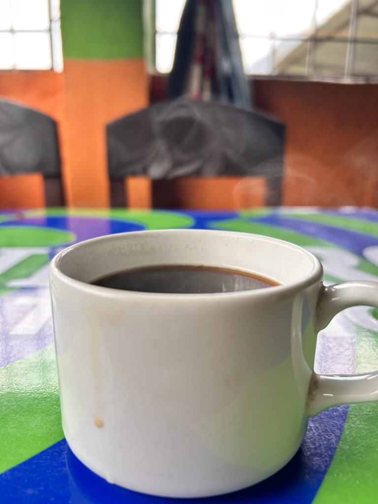 Black coffee in a white ceramic cup.