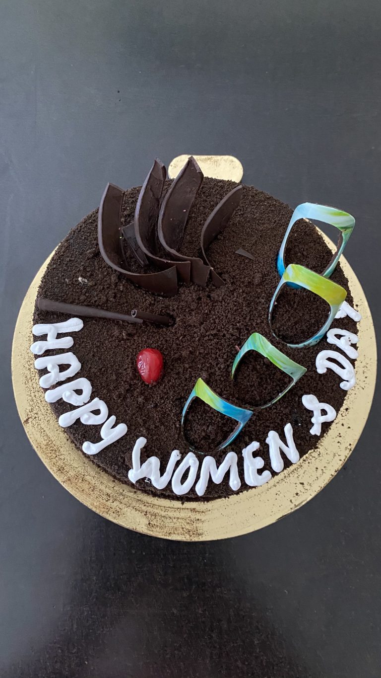 A Chocolate cake written Women’s Day on top