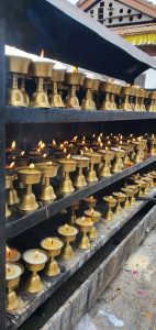 Burning butter oil lamps in the Golden Temple in Kathmandu, Nepal