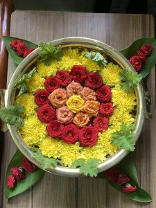 Flower Decoration on a brass pot filled with water during South Indian Festivals.