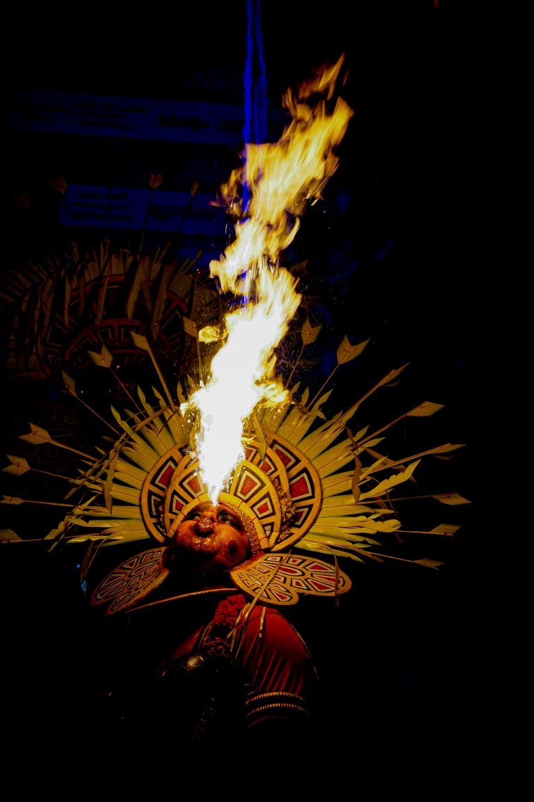 Fiery theyyam performance captivates with intense flames, merging tradition and spectacle. The image portrays the mesmerizing dance of flames within the vibrant cultural context of theyyam.