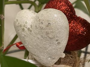 White and red hearts covered in glitter
