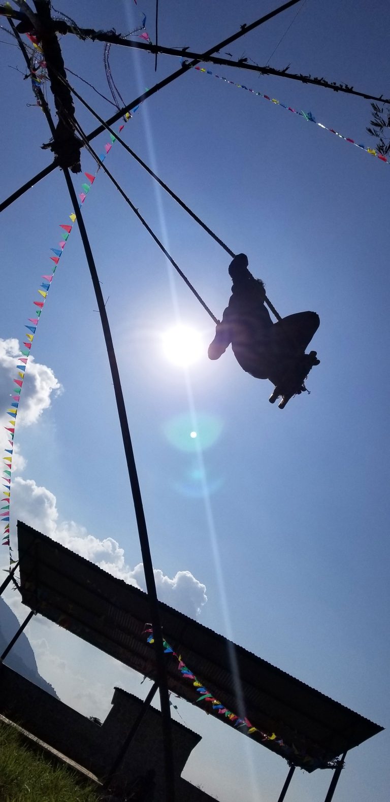 People are playing a traditional bamboo ping, also called a swing, during the Dashain festival in Nepal.