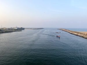 Peaceful harbor view from above, with a few fishing boats gently resting on the water.  Muthalapozhi, Trivandrum, Kerala.