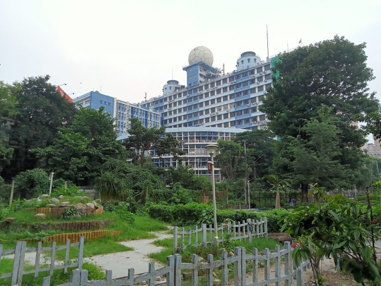 A highrise among trees in Kolkata, West Bengal, India