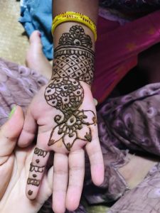 Mehendi art painted on a hand