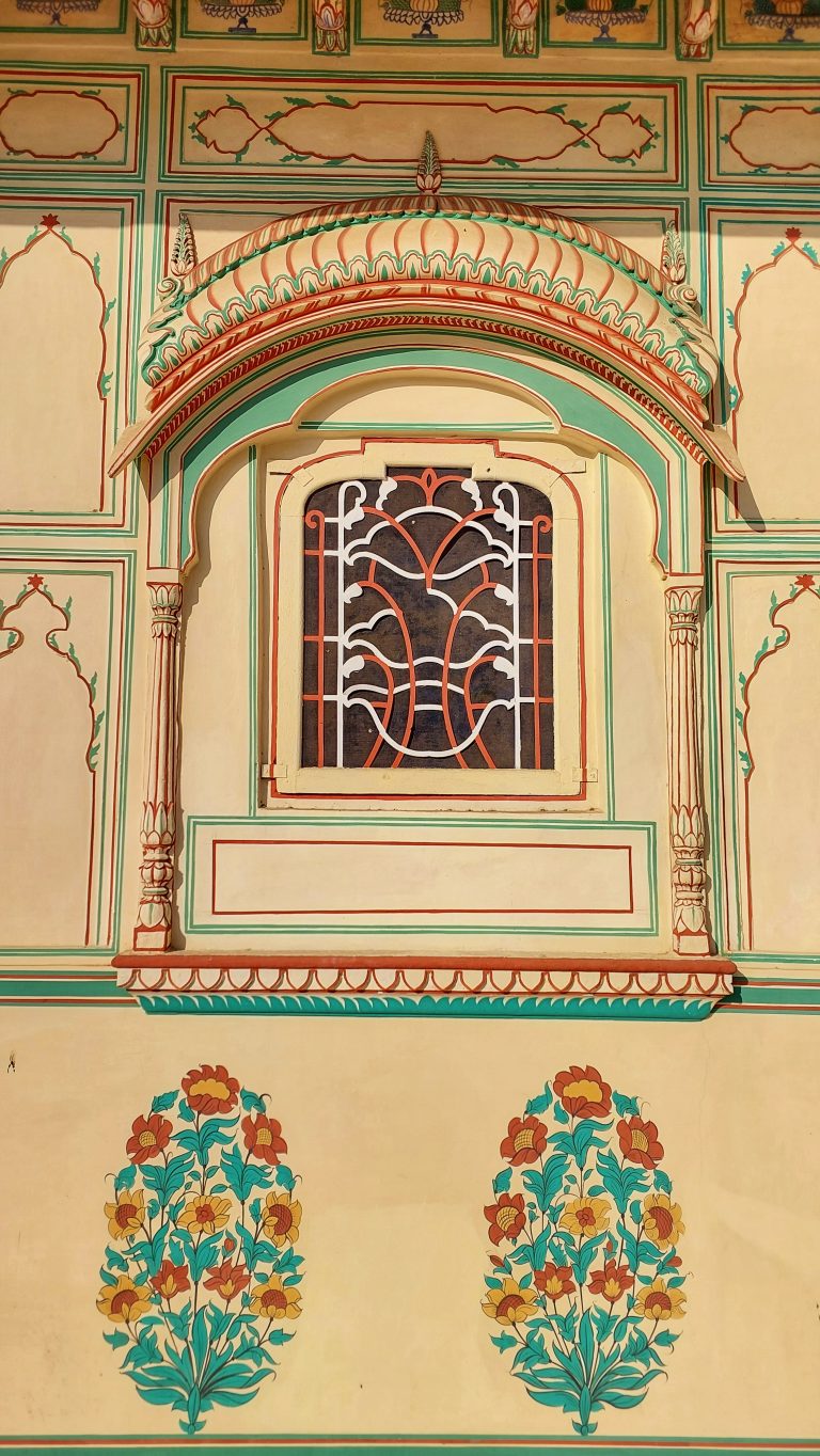 Art and flower plant paintings on the walls of Sisodia Rani ka Bagh located in Jaipur, India.