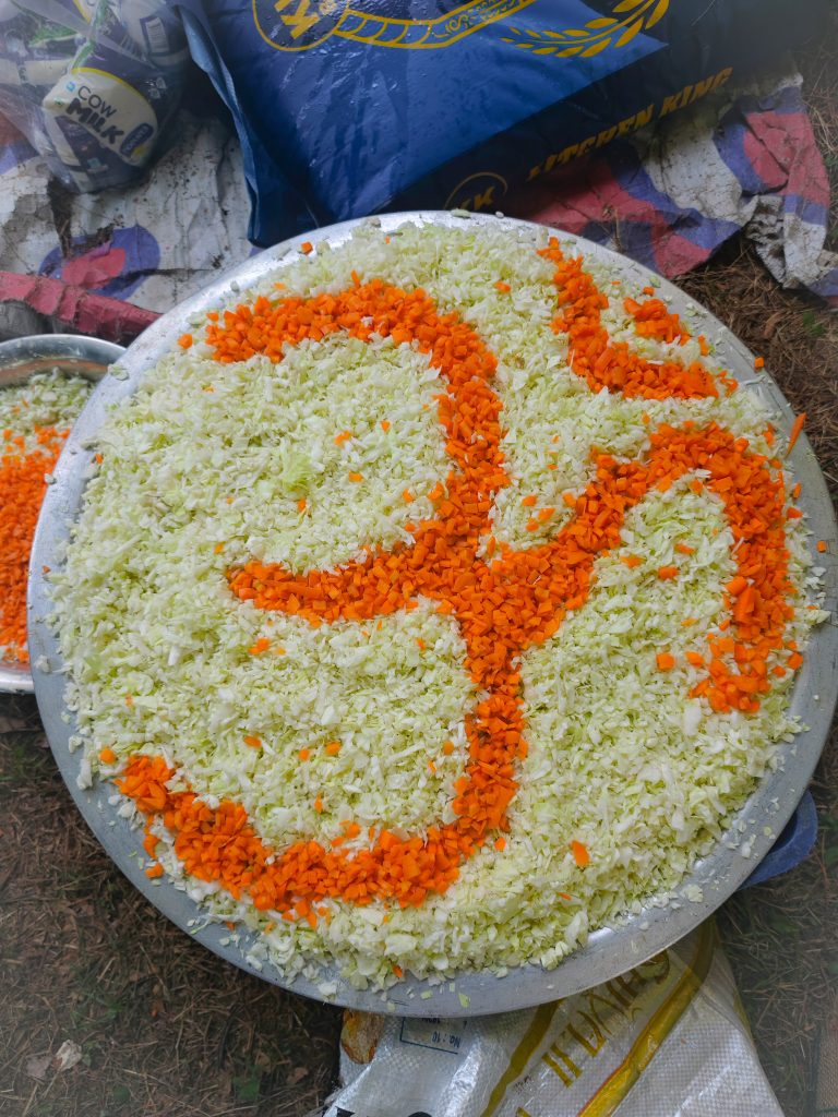 Symbolic Om, made of vegetables on a plate.