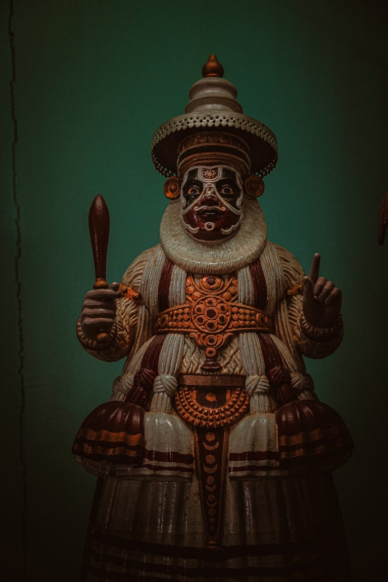 A dynamic Kathakali dance portraying the essence of Kerala’s cultural heritage through vibrant costumes and expressive gestures.