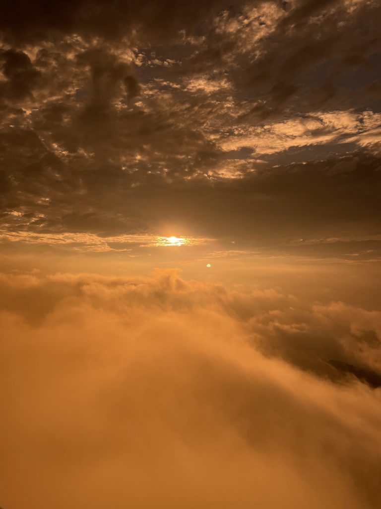 Beautiful sunrise photographed from above the clouds.