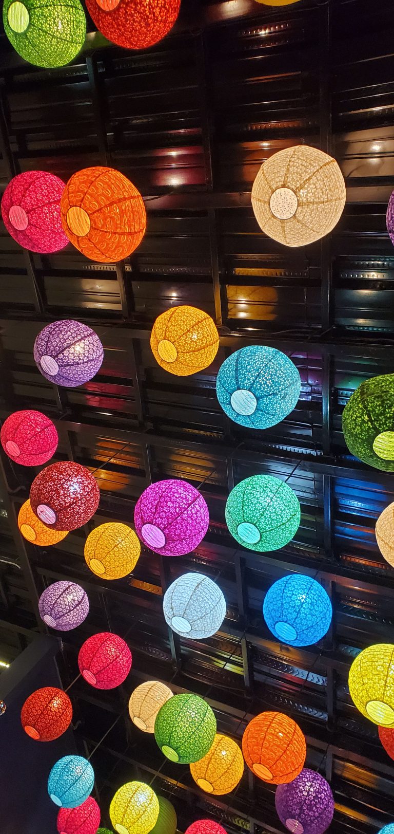 colorful decorative paper lantern hanging on the ceiling.