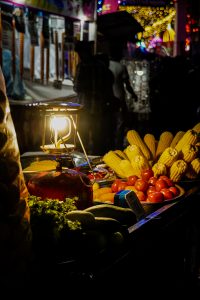 Street food extravaganza captured in a single frame, featuring a vibrant array of culinary delights, sizzling grills, and bustling street vendors, epitomizing the essence of urban gastronomy.