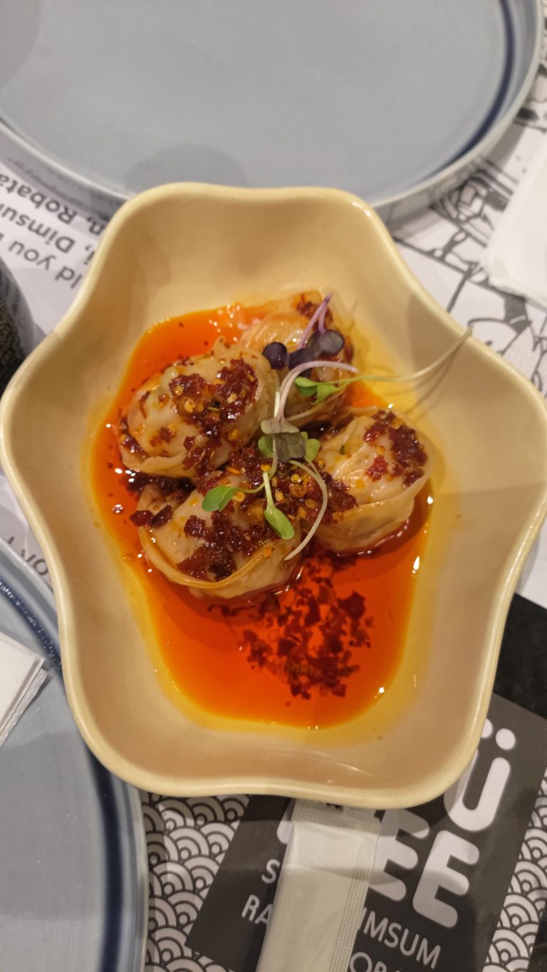 Sichuan chili oil prawn wonton served in a bowl.