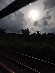 Scenic Indian train journey at dawn: The soft morning light unveils a breathtaking landscape, with picturesque vistas unfolding as the train moves through the serene beauty of the countryside.