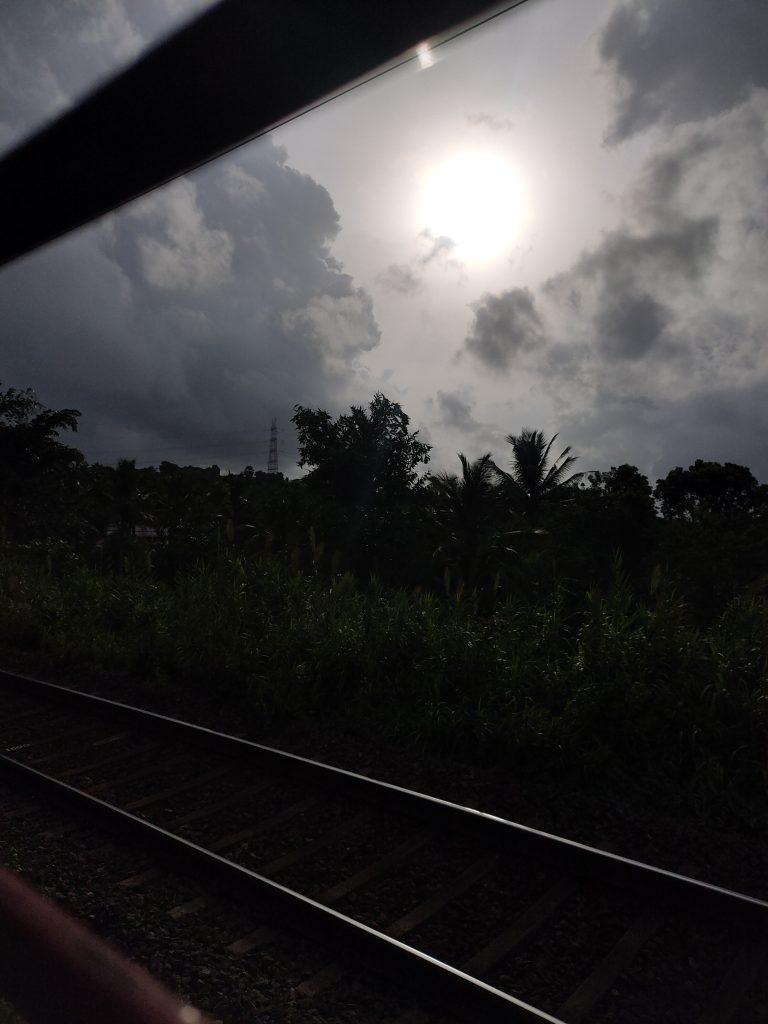 Scenic Indian train journey at dawn: The soft morning light unveils a breathtaking landscape, with picturesque vistas unfolding as the train moves through the serene beauty of the countryside.