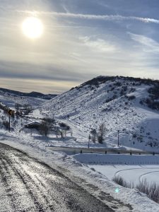 Midday sunshine over snow covered hills near Saddleback Ranch (Steamboat Springs, Colorado)
