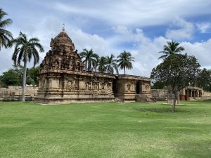 A quaint archaeological temple stands gracefully amidst a serene lawn. Gangaikonda Cholapuram, Ariyalur district, Tamil Nadu, India.