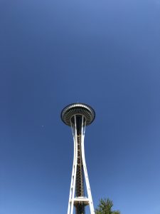 The Seattle Space Needle against a clear, deep blue sky.