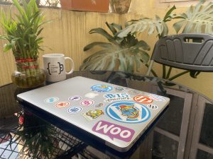 Dedicated WordPress contributor’s Laptop, a canvas of colorful stickers, representing achievements and community bonds. Embrace the joy of creating!
