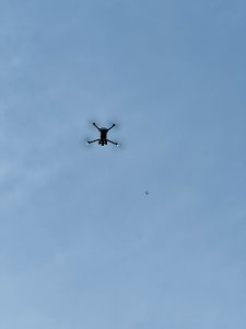 Two drones flying to take aerial shots.  