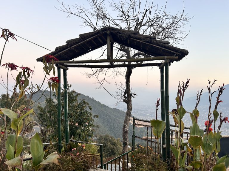 A rustic bamboo and grass gate in the mountains