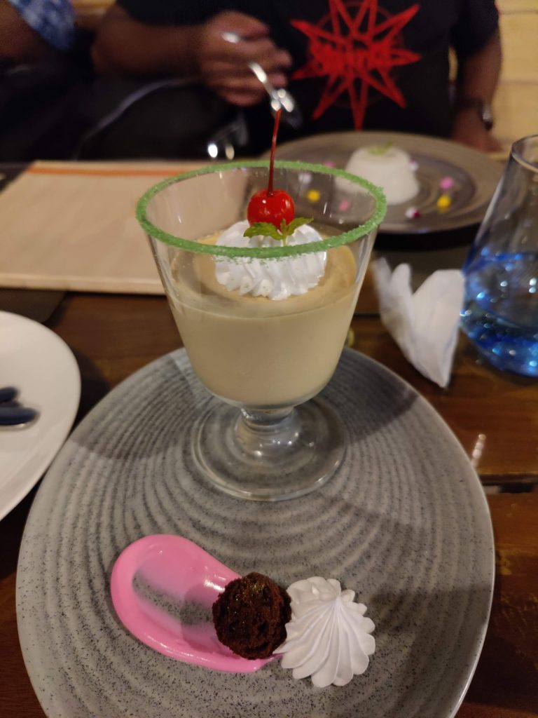 Tea pudding, desert with a flavor reminiscing traditional Kerala tea topped with fresh cream and cherry.