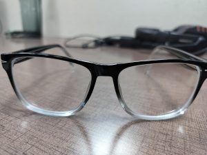 Clear glasses with black frames on a table