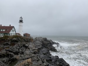 The Portland Head Light in Fort Williams Park, Cape Elizabeth, Maine on a dark, dreary day.
