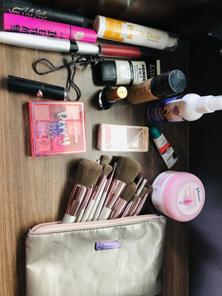 A variety of cosmetics items showcased on the table.