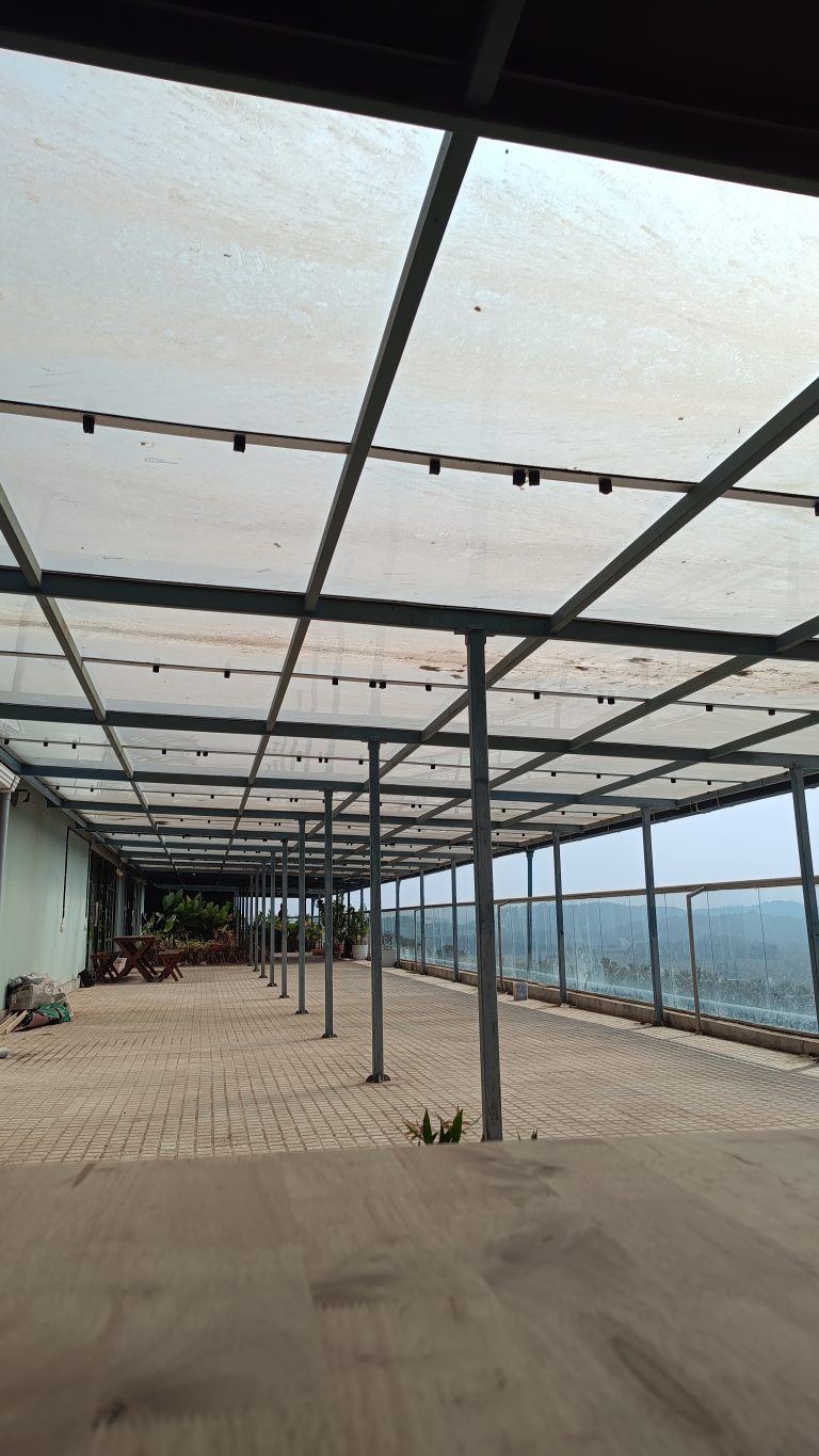 An empty Balcony with glass roofing