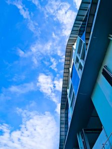 View larger photo: Side view of a blue building with clear blue sky in the background. Cyberpark Kozhikode.