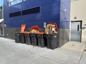 Recycle bins stuffed with cardboard.
