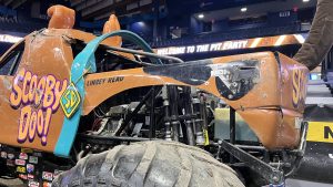 Driver's side rear corner view of Scooby Doo! Monster Jam monster truck, driven by Linsey Read (Allstate Arena, Rosemont, Illinois)