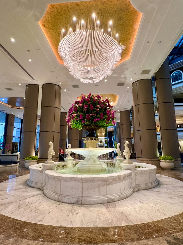 Large fountain in a hotel lobby in Taipei – with water and fresh flowers