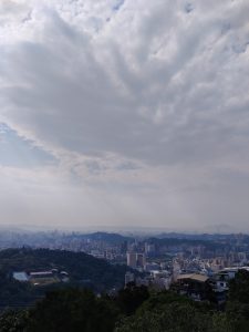 Overview of Taipei city in Taiwan from the top of the mountain. You can see the whole city panoram, nature and sky.