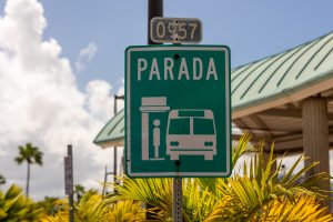 View larger photo: Bus stop sign in Puerto Rico on a partly cloudy day.