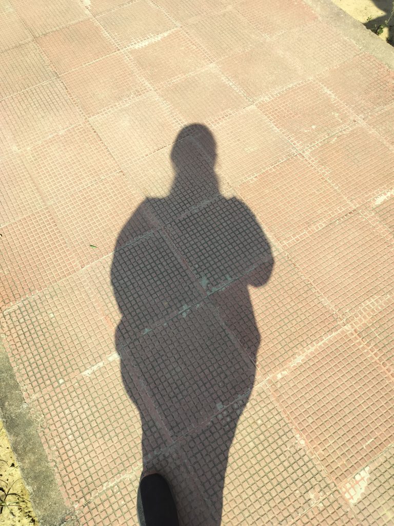 Shadow on the ground of the photographer