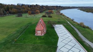 Zapyskis, Lithuania, 16th century church, gothic style, drone picture. Nemunas river on side