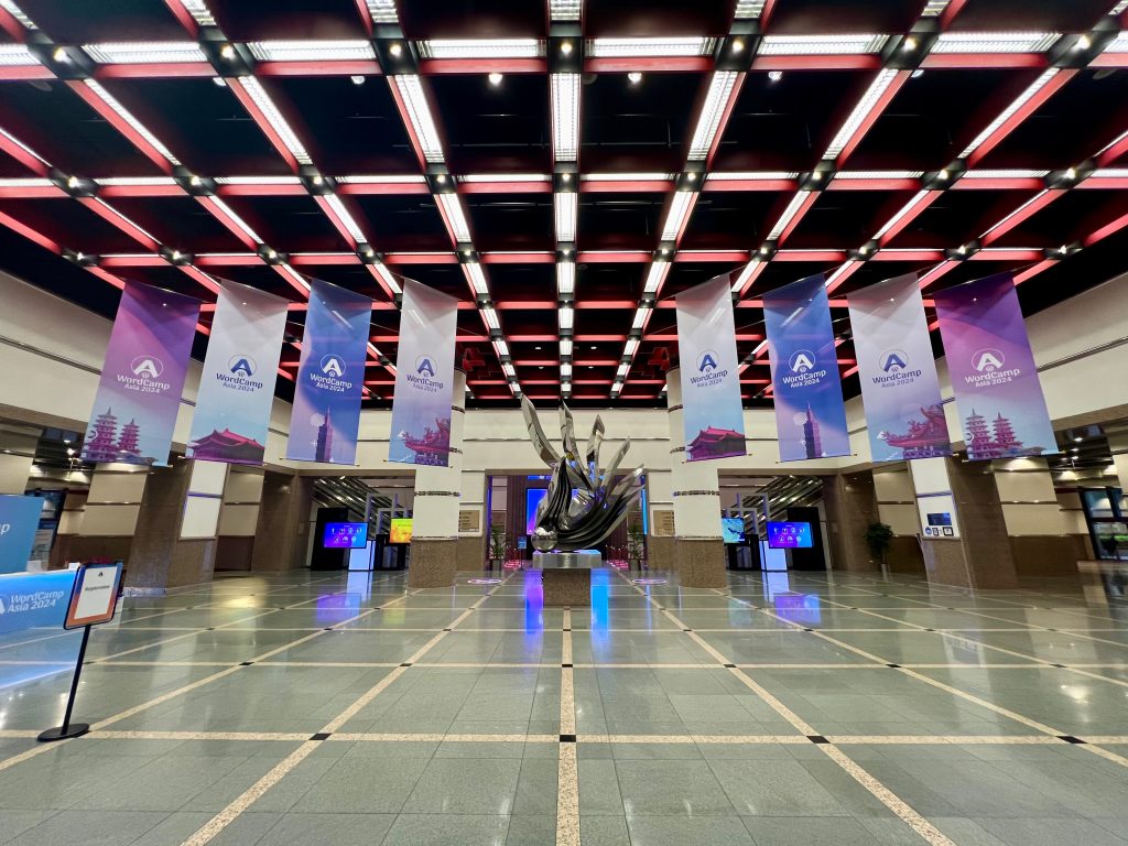 WordCamp Asia 2024 banners hang at the entrance hall of the Taipei International Convention Center (TICC) in Taiwan.