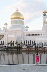 Mosque dome with a child in the foreground, Bandar Seri Begawan, Brunei
