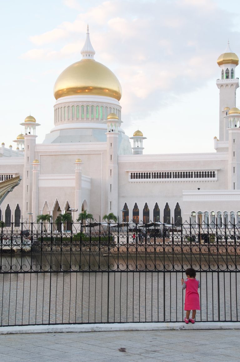 Mosque dome with a child in the foreground, Bandar Seri Begawan, Brunei