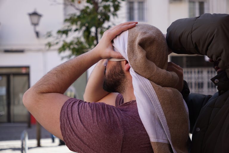 Costalero getting ready to carry a holy week paso in Sevilla