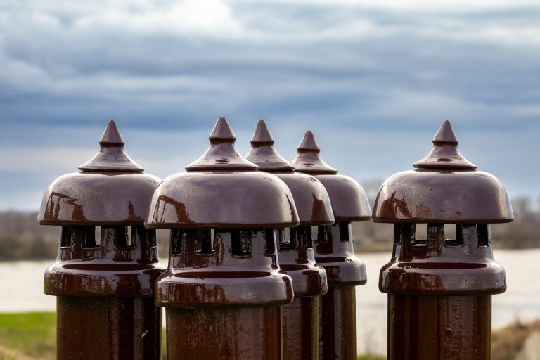 Ceramic ventilation ducts on the roof of Fort Pannerden, the Netherlands. With a blue sky in the background.