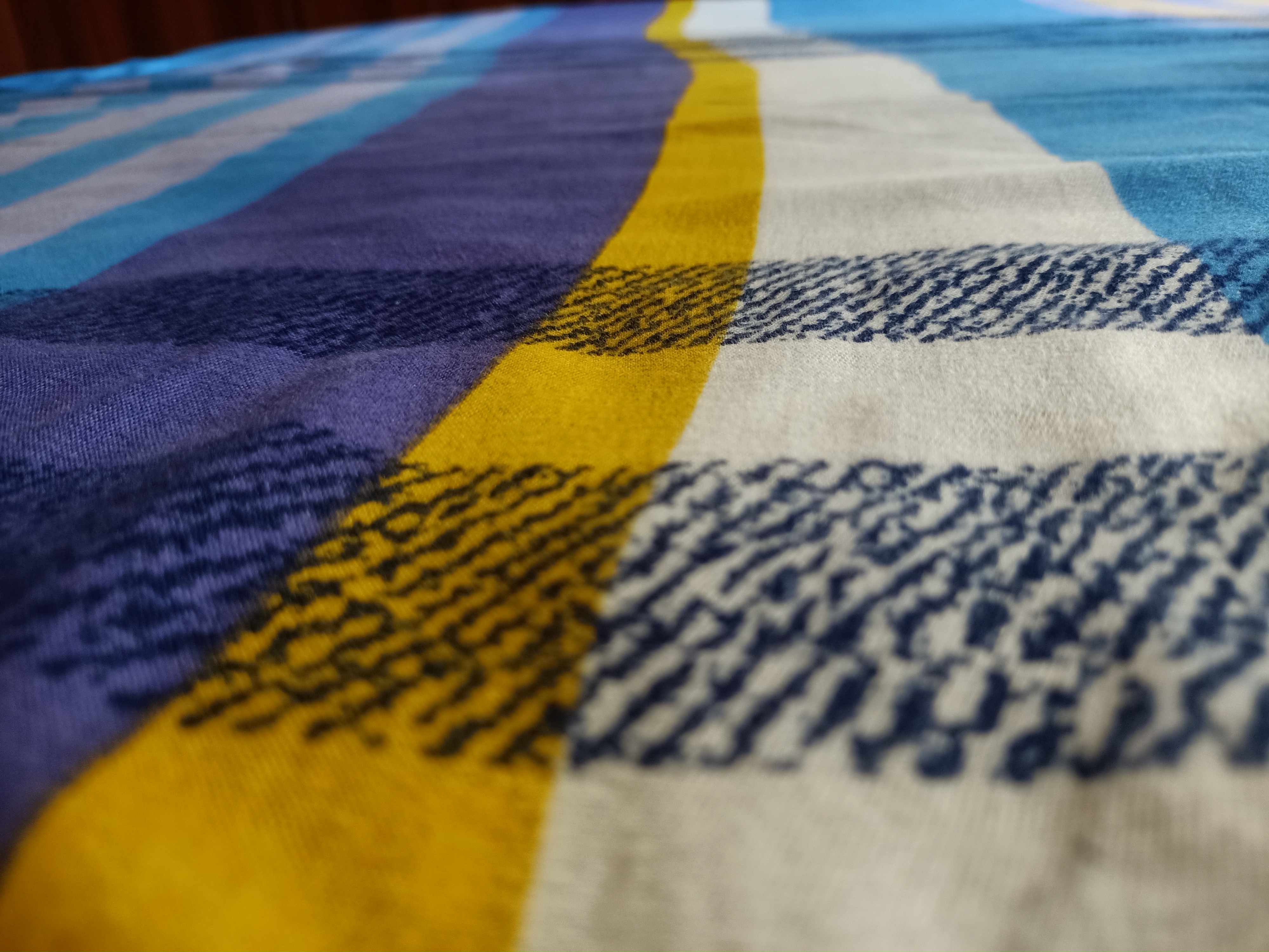 Macro photography of a wool scarf in various colors