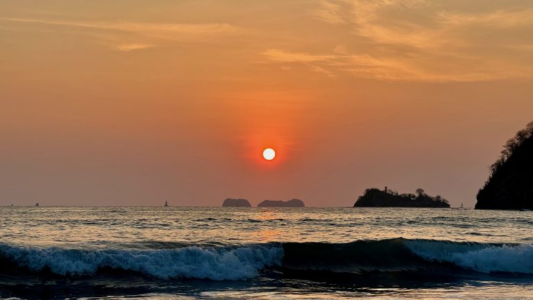 Stunning sunset view over the ocean at Sugar Beach, Costa Rica.