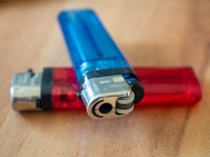 A macro picture of blue and red lighters