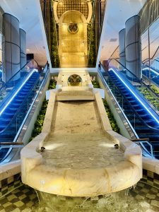 A small waterfall and escalator in a hotel of Taipei.
