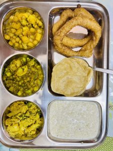 Different items of food named roti, puri, khir, etc prepared on the occasion of Puja. Puja means an event where we worship god.